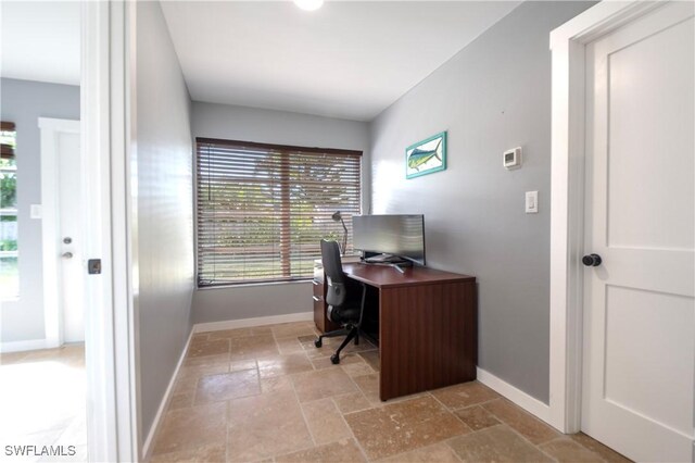 106 Pago Pago Dr W, Naples, FL 34113 - office area with stone tile floors and baseboards
