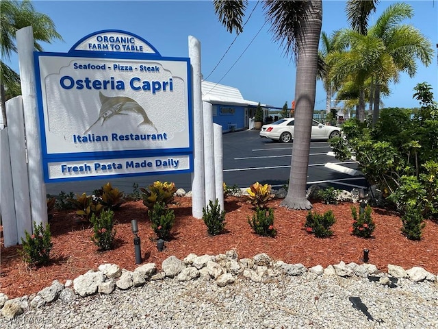 106 Pago Pago Dr W, Naples, FL 34113 - community / neighborhood sign featuring uncovered parking