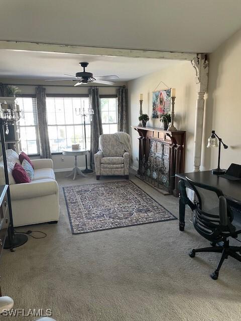 living room featuring carpet flooring and ceiling fan