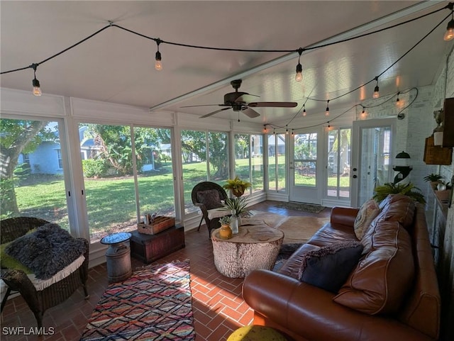 sunroom / solarium featuring a wealth of natural light and ceiling fan