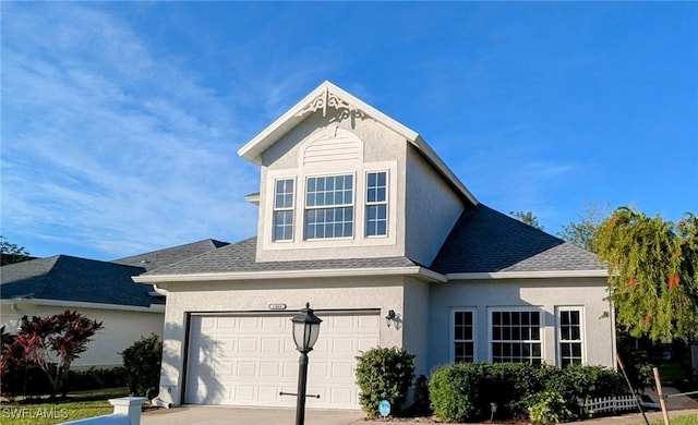 view of front of property with a garage