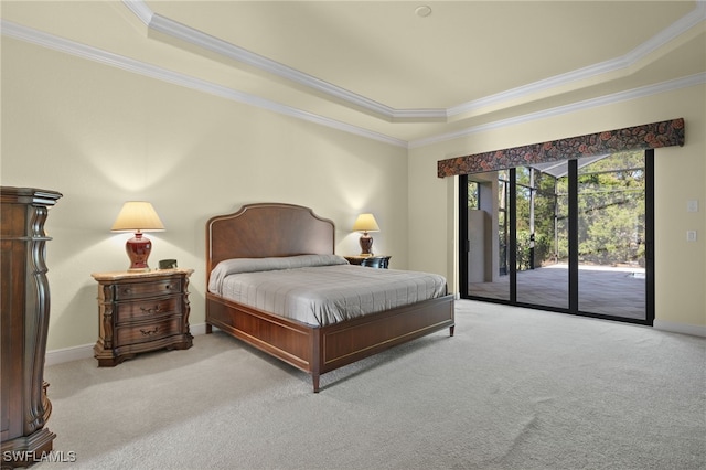 carpeted bedroom featuring access to outside, a raised ceiling, and ornamental molding