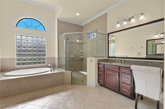 bathroom featuring tile patterned floors, vanity, separate shower and tub, and crown molding