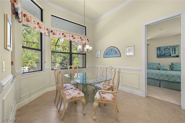 tiled dining space with an inviting chandelier and crown molding