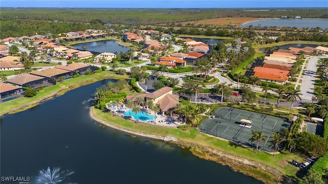 birds eye view of property with a water view