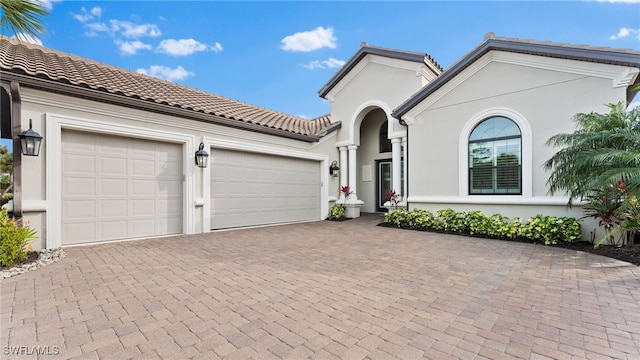 view of front of home with a garage