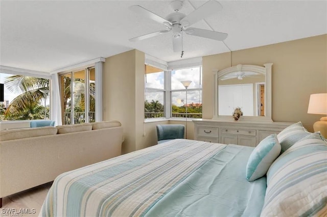 bedroom with ceiling fan and light wood-type flooring