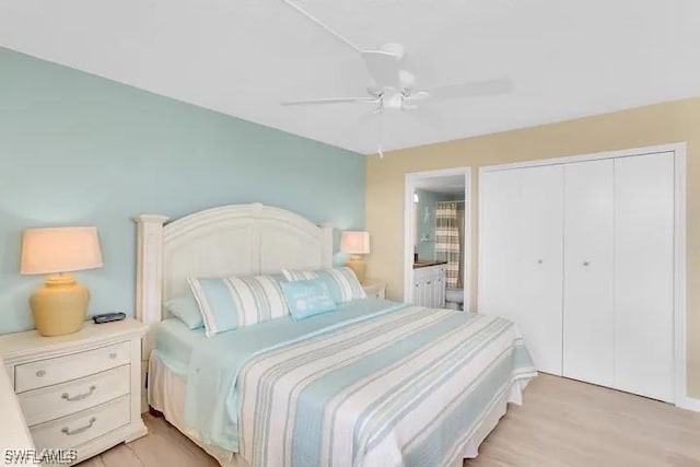 bedroom with a closet, ceiling fan, light hardwood / wood-style flooring, and ensuite bathroom