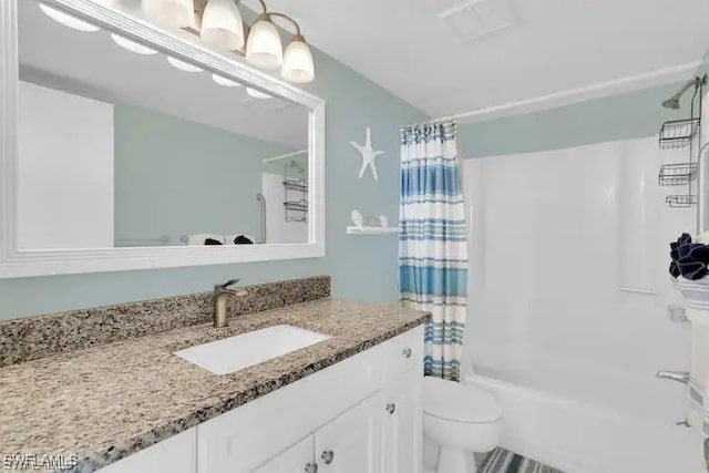 full bathroom featuring vanity, toilet, and shower / bath combo with shower curtain