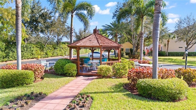 surrounding community featuring a gazebo and a lawn