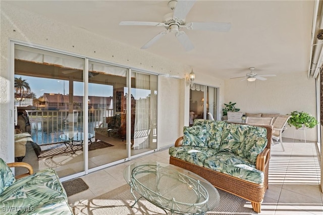 interior space with ceiling fan and light tile patterned floors