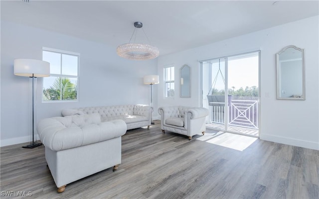 living room with wood-type flooring and plenty of natural light