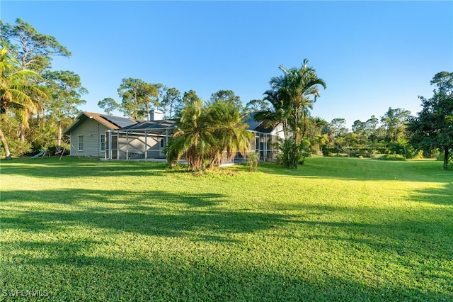 view of yard with a lanai