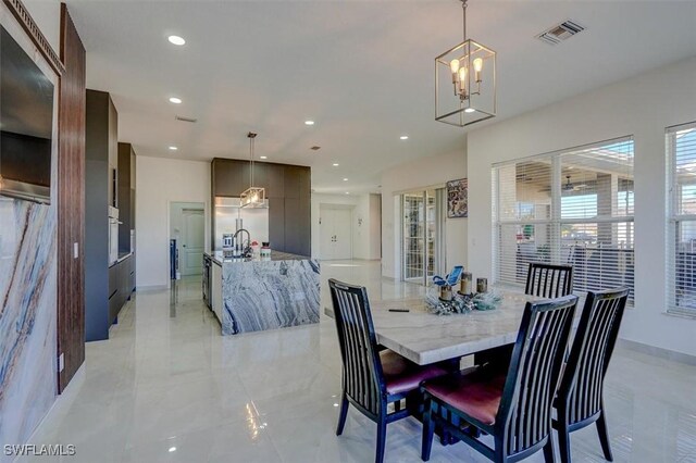 dining space with a notable chandelier