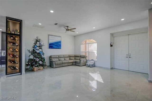 living room featuring ceiling fan