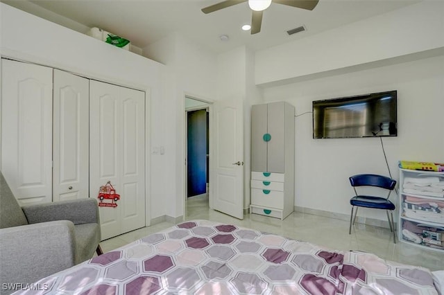 bedroom with ceiling fan and a closet