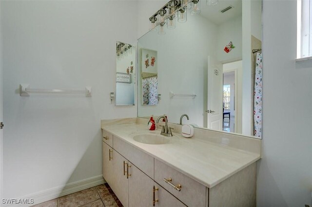 bathroom featuring tile patterned floors and vanity