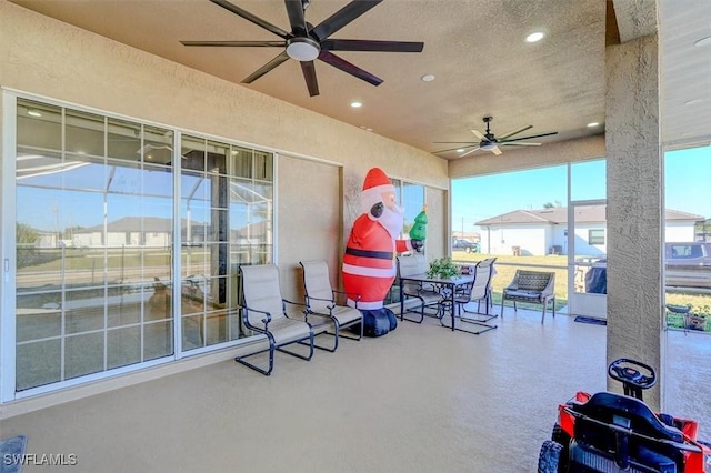 view of patio featuring ceiling fan