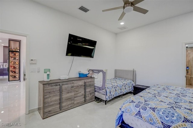 bedroom featuring connected bathroom and ceiling fan