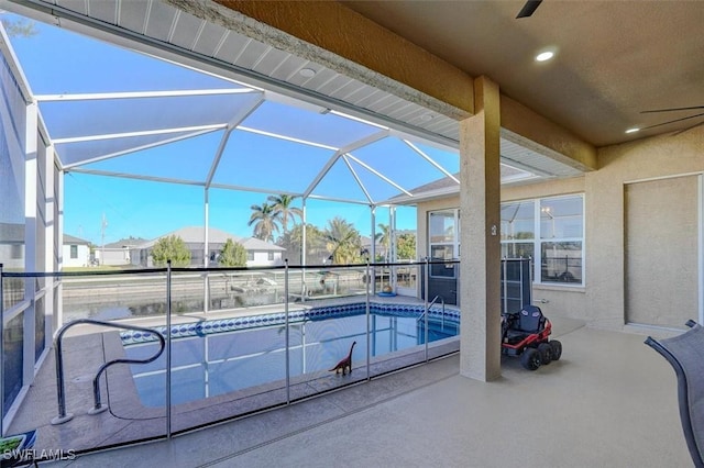 view of pool featuring a lanai