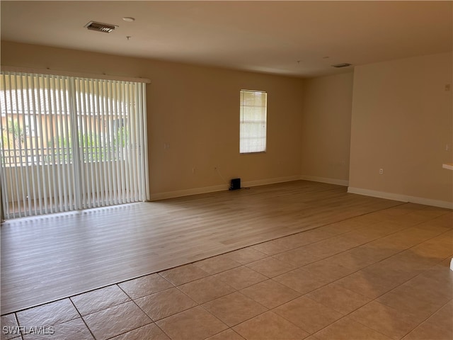 empty room with light hardwood / wood-style floors