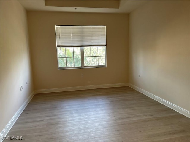 unfurnished room featuring light hardwood / wood-style floors