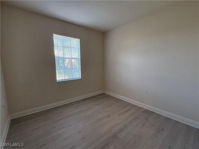 unfurnished room featuring light wood-type flooring