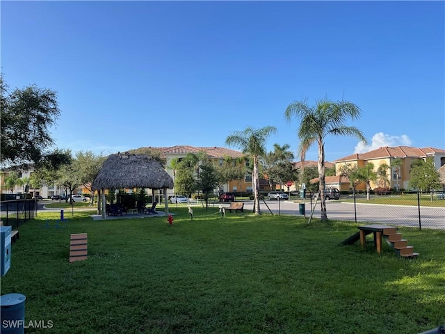 view of property's community featuring a gazebo and a lawn