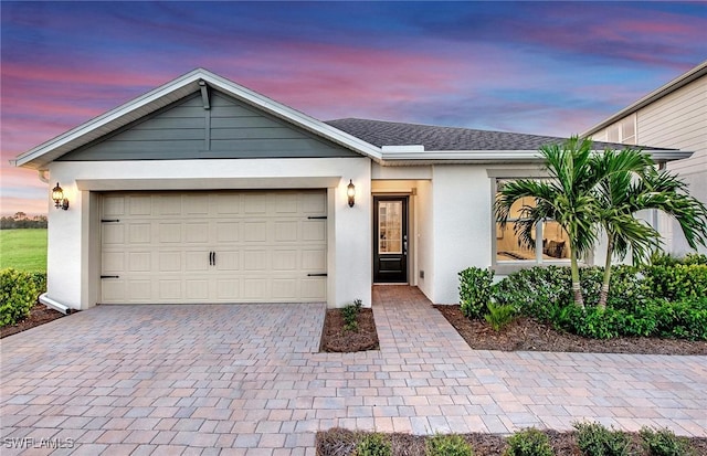 single story home featuring a garage