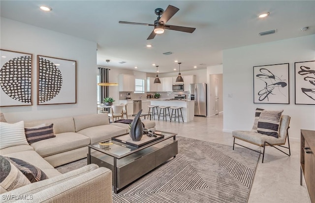 living room featuring ceiling fan