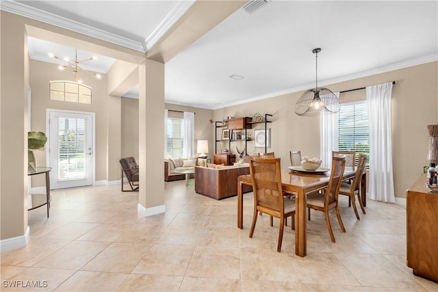 tiled dining area with ornamental molding and a notable chandelier