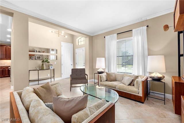 living room featuring light tile patterned flooring, ornamental molding, and a chandelier