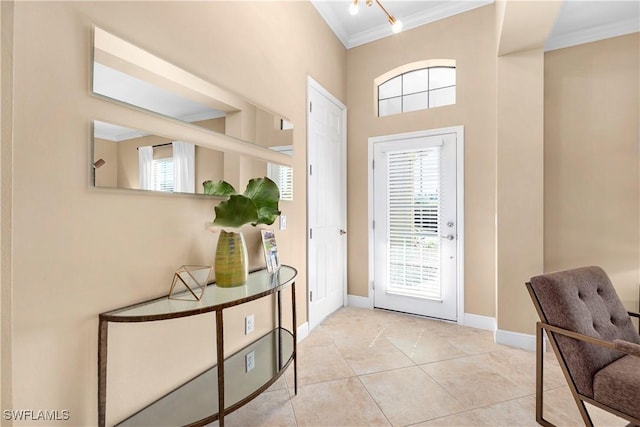 doorway with ornamental molding, a healthy amount of sunlight, and light tile patterned flooring