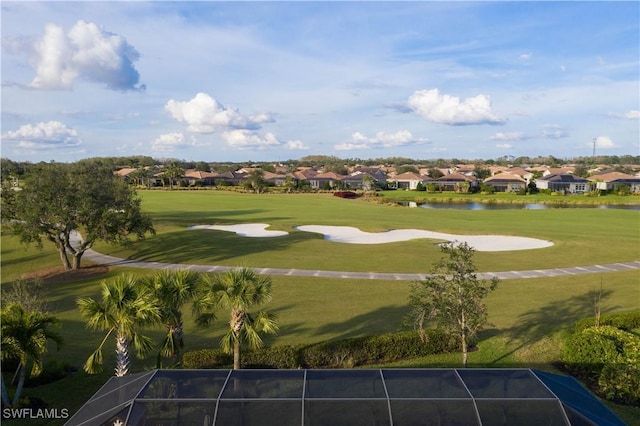 view of community featuring a water view and a lawn