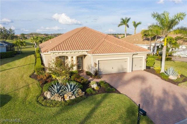 mediterranean / spanish-style home with a garage and a front yard