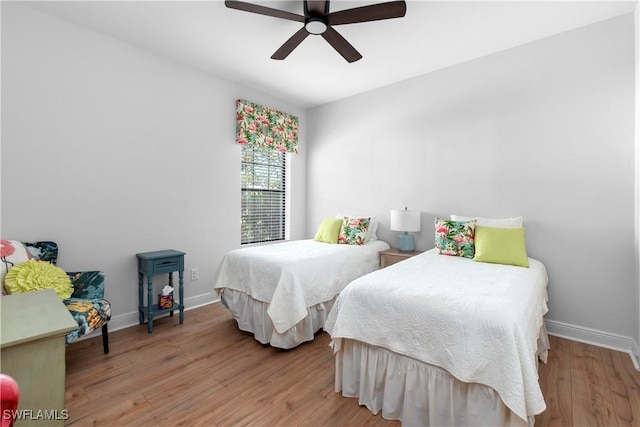 bedroom featuring ceiling fan and light hardwood / wood-style flooring