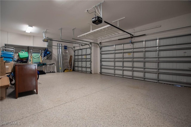 garage featuring a garage door opener