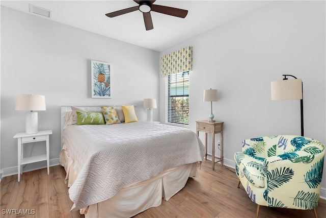 bedroom with ceiling fan and wood-type flooring