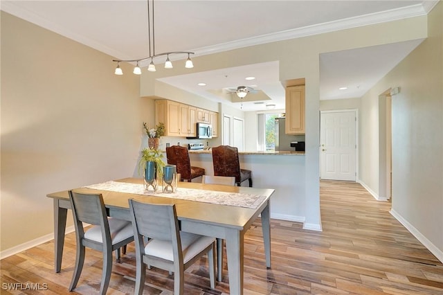 kitchen featuring light brown cabinets, light wood-type flooring, and kitchen peninsula