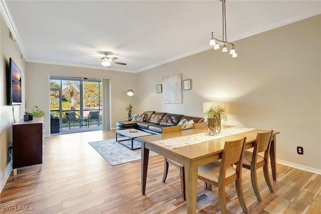 dining room with crown molding, ceiling fan, and light hardwood / wood-style floors