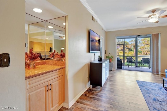 interior space with crown molding and light wood-type flooring