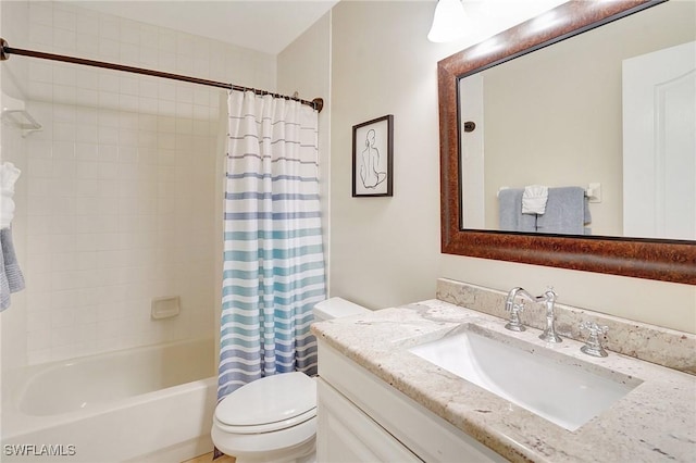 full bathroom with vanity, shower / bath combo, and toilet