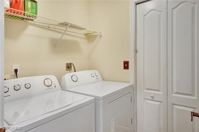 washroom featuring washer and dryer