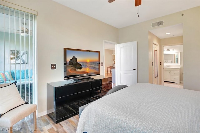 bedroom featuring ceiling fan, connected bathroom, and light wood-type flooring