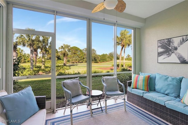 sunroom / solarium featuring ceiling fan