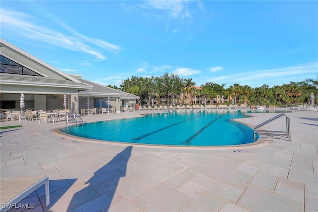 view of pool featuring a patio area