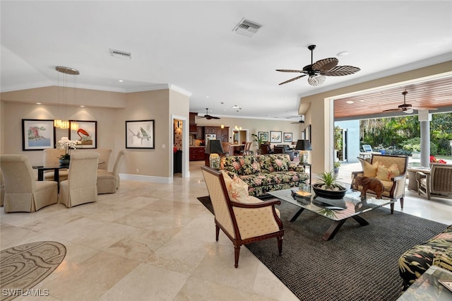 living room with ceiling fan and ornamental molding