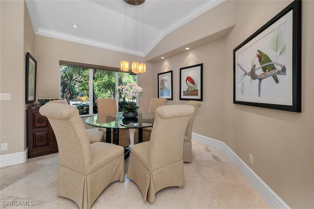 dining area with vaulted ceiling, crown molding, and a notable chandelier