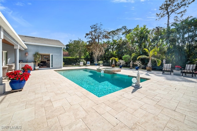 view of pool featuring an in ground hot tub and a patio