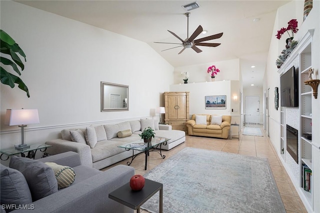 living room featuring light tile patterned floors, high vaulted ceiling, and ceiling fan